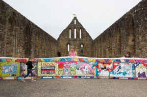 EDITORIAL USE ONLY L-R Emily Ure, Kiera Torrance and Bella Ure take a look at a sequel to the Bayeux Tapestry, commissioned by English Heritage, to mark the 950th anniversary of the Battle of Hastings in 1066, at Battle Abbey in East Sussex. PRESS ASSOCIATION Photo. Picture date: Monday August 1, 2016. The Kids' Tapestry features the top 10 moments in English history since 1066, as voted for by children. Created by Liz, The Kids Tapestry will tour English Heritage sites this summer and children are invited to submit their own illustrations to complete the final panel. Photo credit should read: David Parry/PA Wire