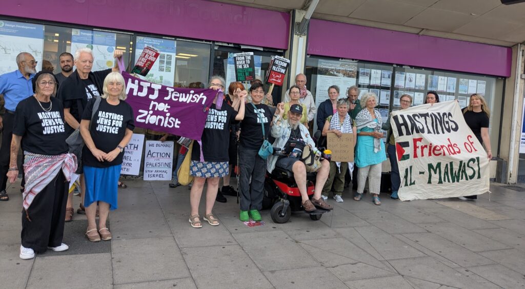 The current image has no alternative text. The file name is: Hastings-residents-celebrate-Gaza-motion-passing-.jpg