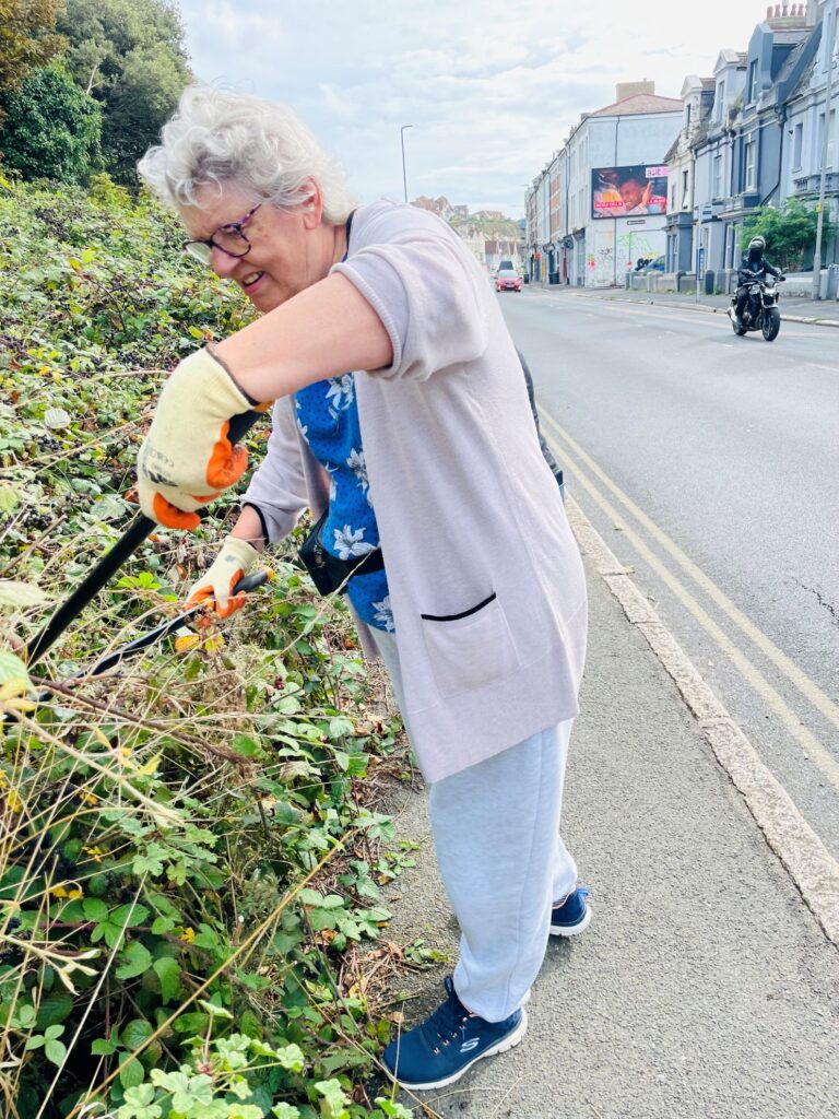 The current image has no alternative text. The file name is: COM.A-member-of-the-Community-Team-of-St-Leonards-at-work.jpg