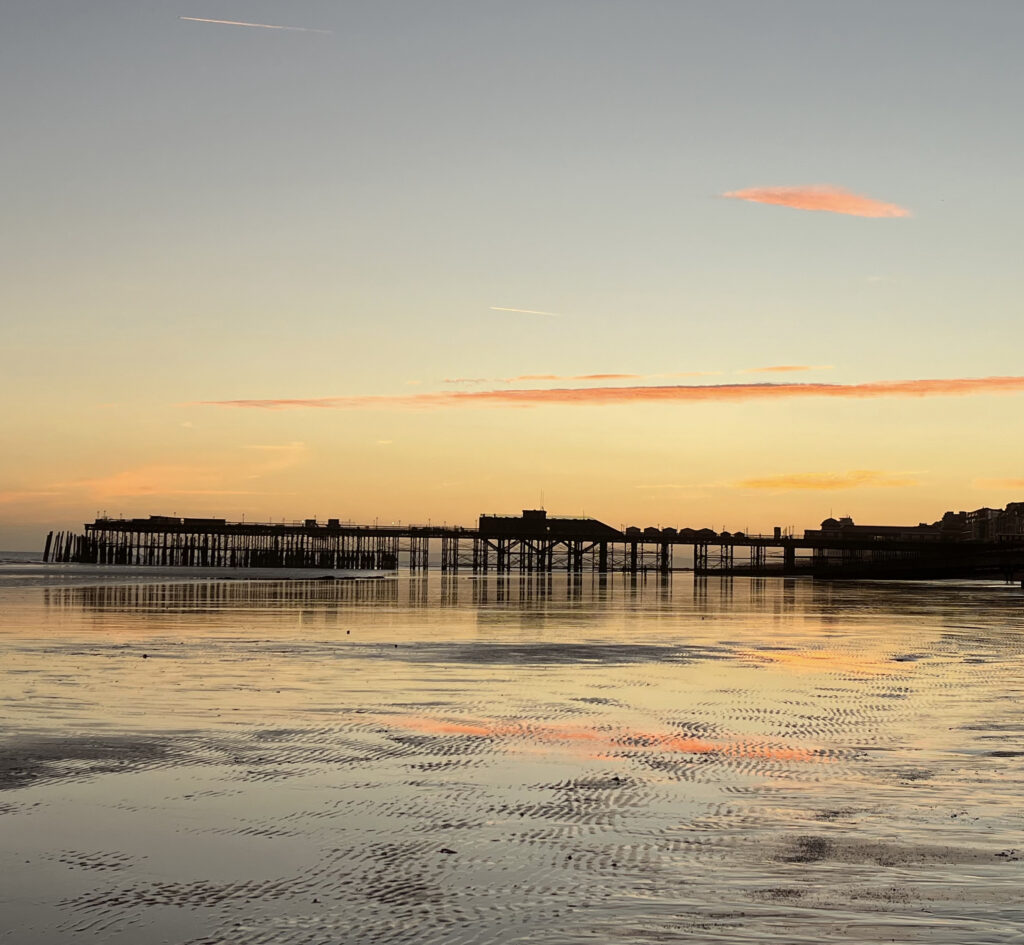 The current image has no alternative text. The file name is: Pier-Sunset-scaled.jpg
