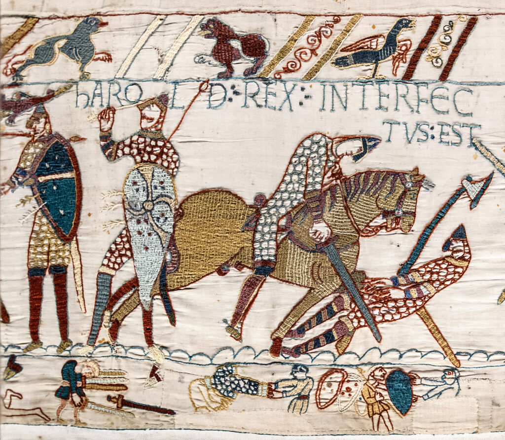 The current image has no alternative text. The file name is: Bayeux_Tapestry_scene57_Harold_death-scaled.jpg
