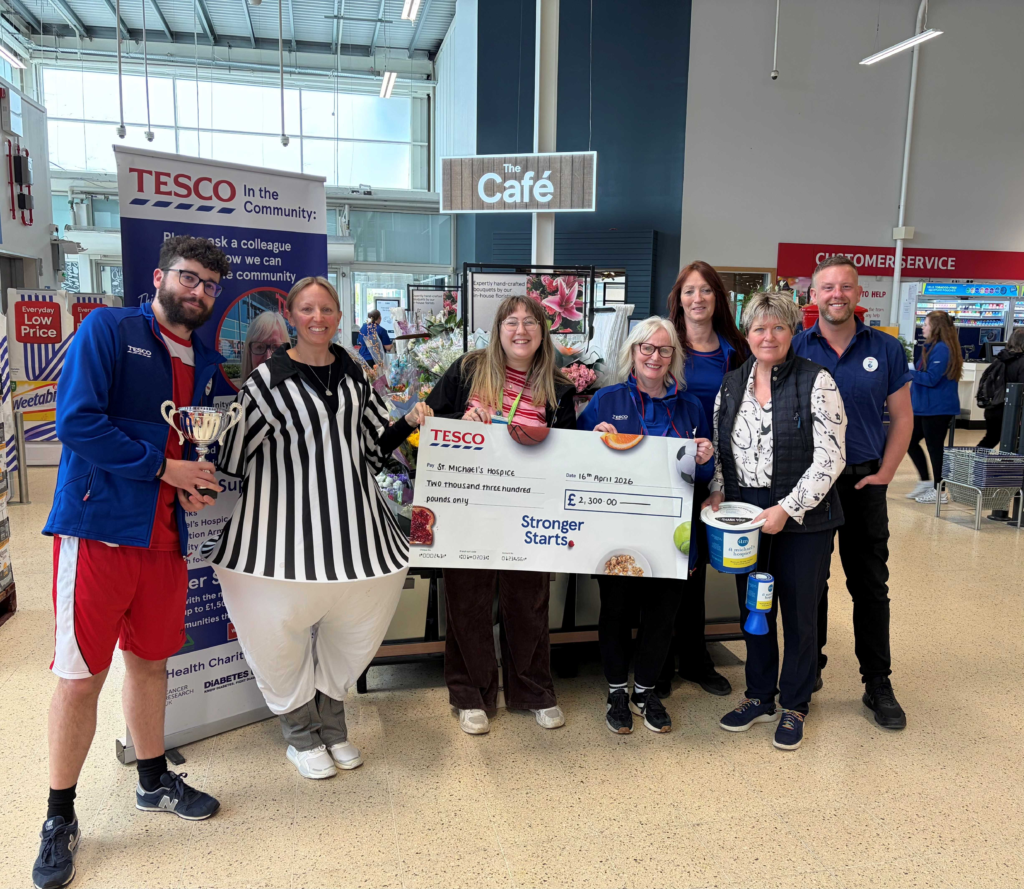 The current image has no alternative text. The file name is: COMMUNITY-CAPTION-Tesco-strikes-gold-for-St.-Michaels-Hospice-scaled.png