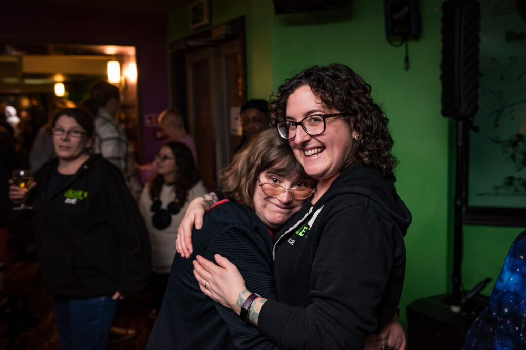 The current image has no alternative text. The file name is: COMMUNITY.Millie-with-nightclub-guest-Charlie-scaled.jpg