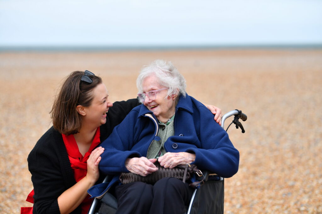 The current image has no alternative text. The file name is: COMMUNITY-CAPTION-Marjorie-with-Hannah-lifestyle-lead-at-Heathfield-Court.jpg-scaled.jpeg